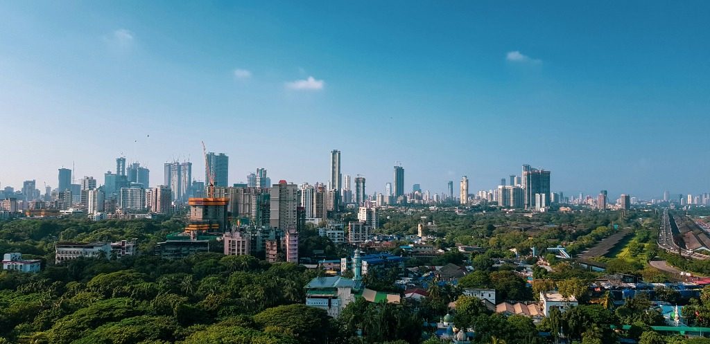 Aerial view of a Global South city skyline and urban green space